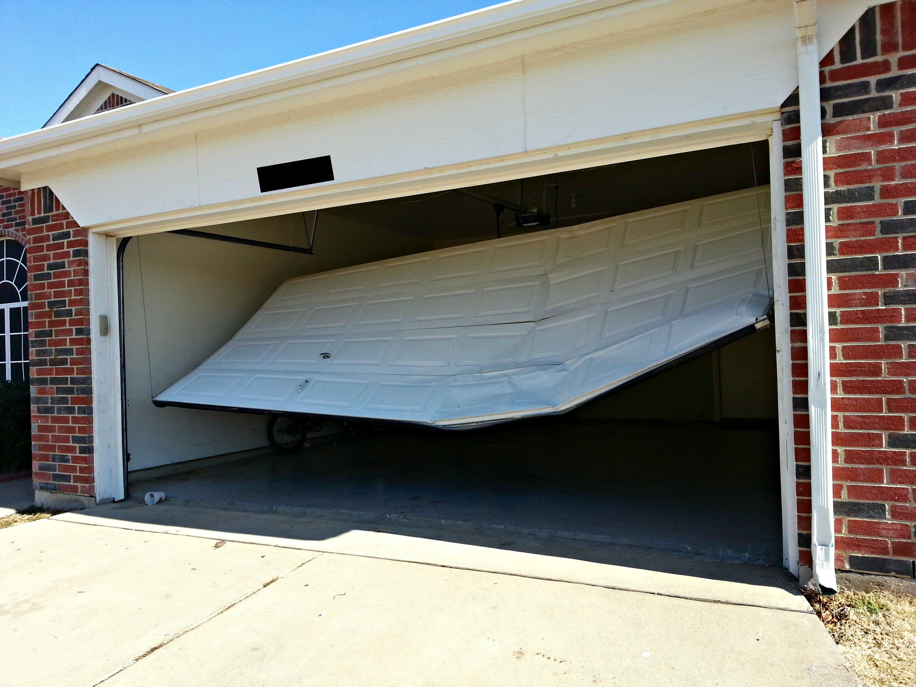 broken garage door set for repair in florida